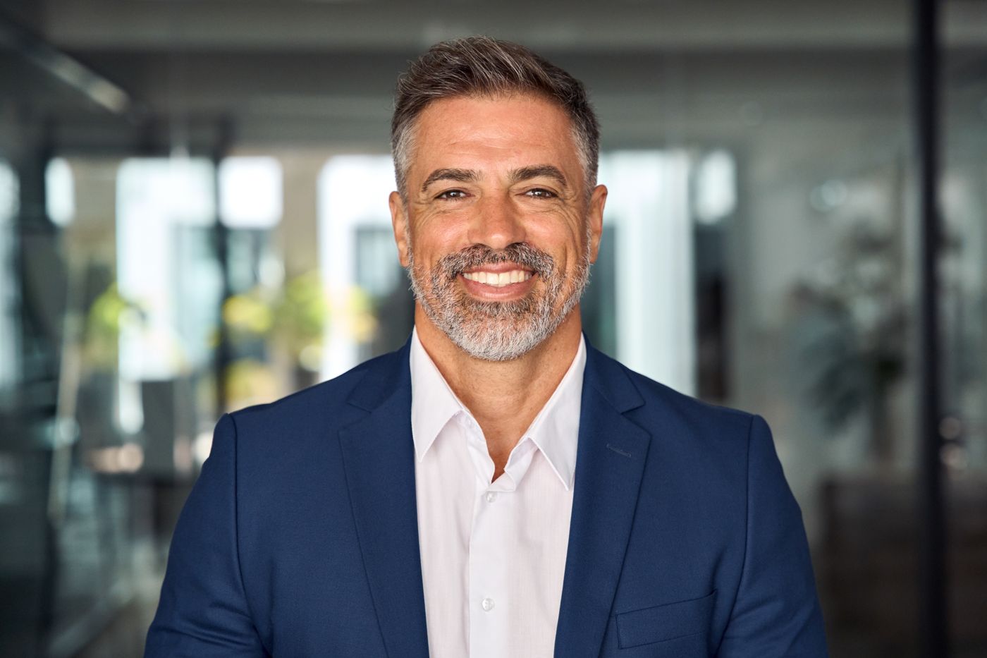 Smiling middle-aged man in a blue blazer