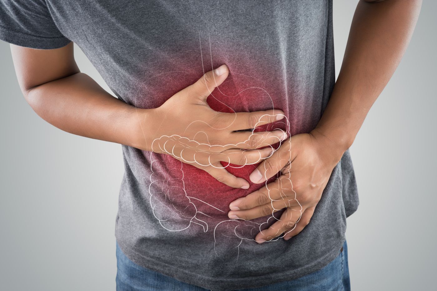 Person holding their abdomen with the bowel illustrated